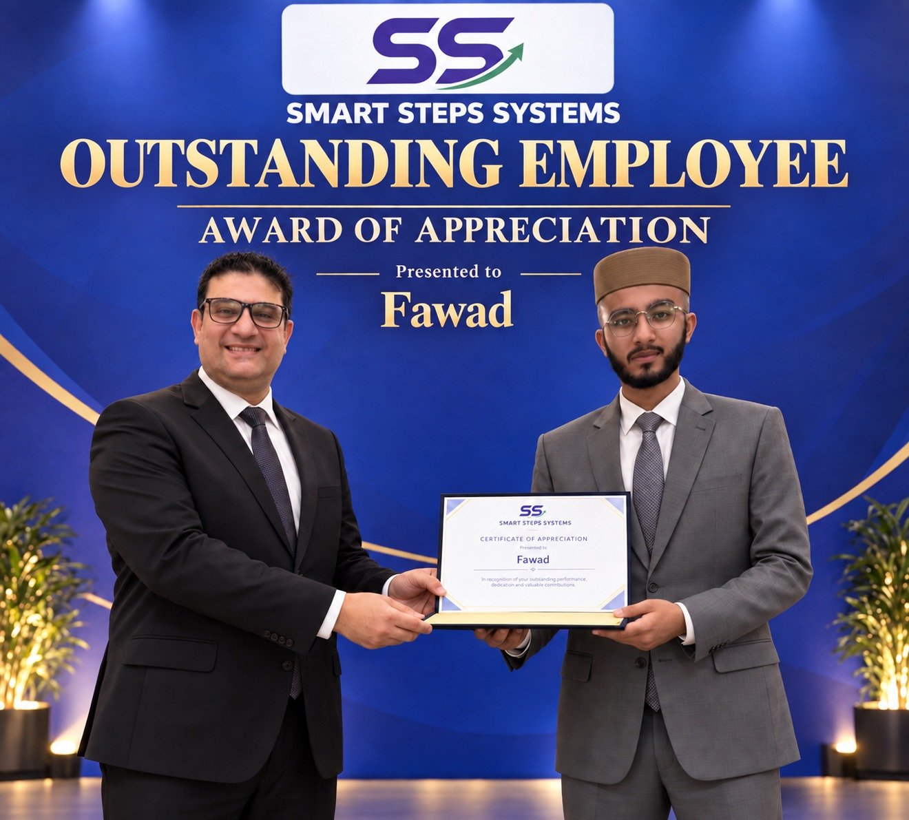 Mohamed Eissa, CEO and Founder of Smart Steps Systems, presents Fawad with the Outstanding Employee Award of Appreciation